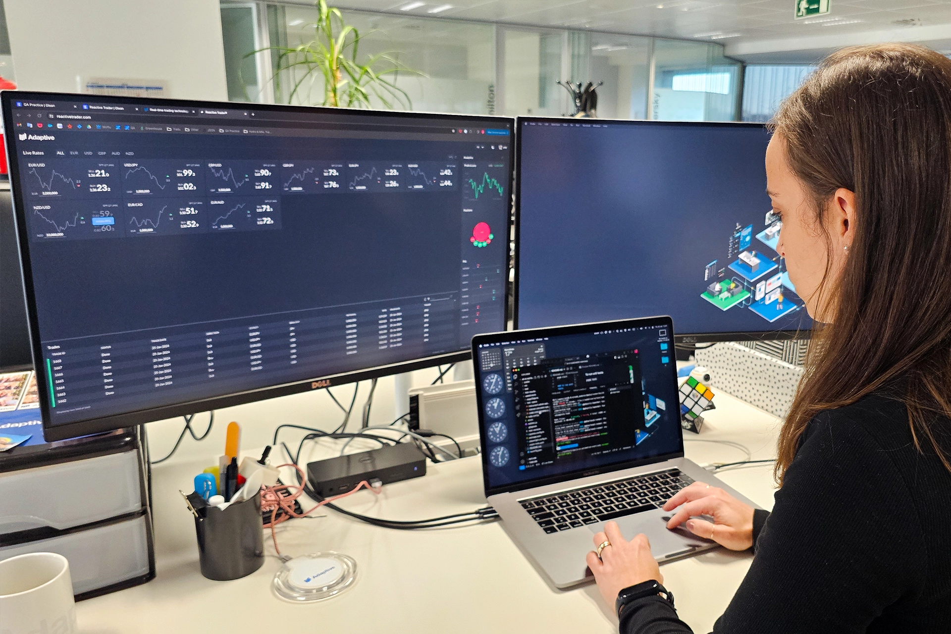 Woman coding at Adaptive