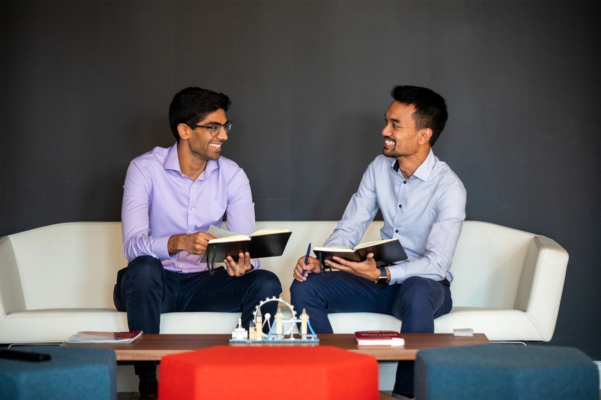 Two men talking and laughing at Adaptive